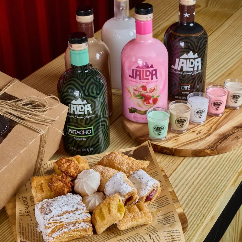 a bottle of wine sitting on top of a wooden table