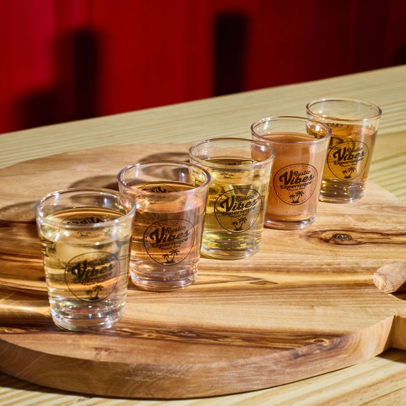 a cup of coffee sitting on top of a wooden table