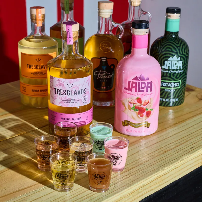 a close up of a bottle and a glass of beer on a table